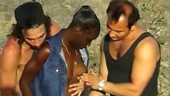 Two White Guys Pleasure A Black Woman At The Beach